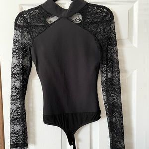 Bebe Black Lace Bodysuit. Size XS. Lace Sleeves. Worn once. In perfect condition